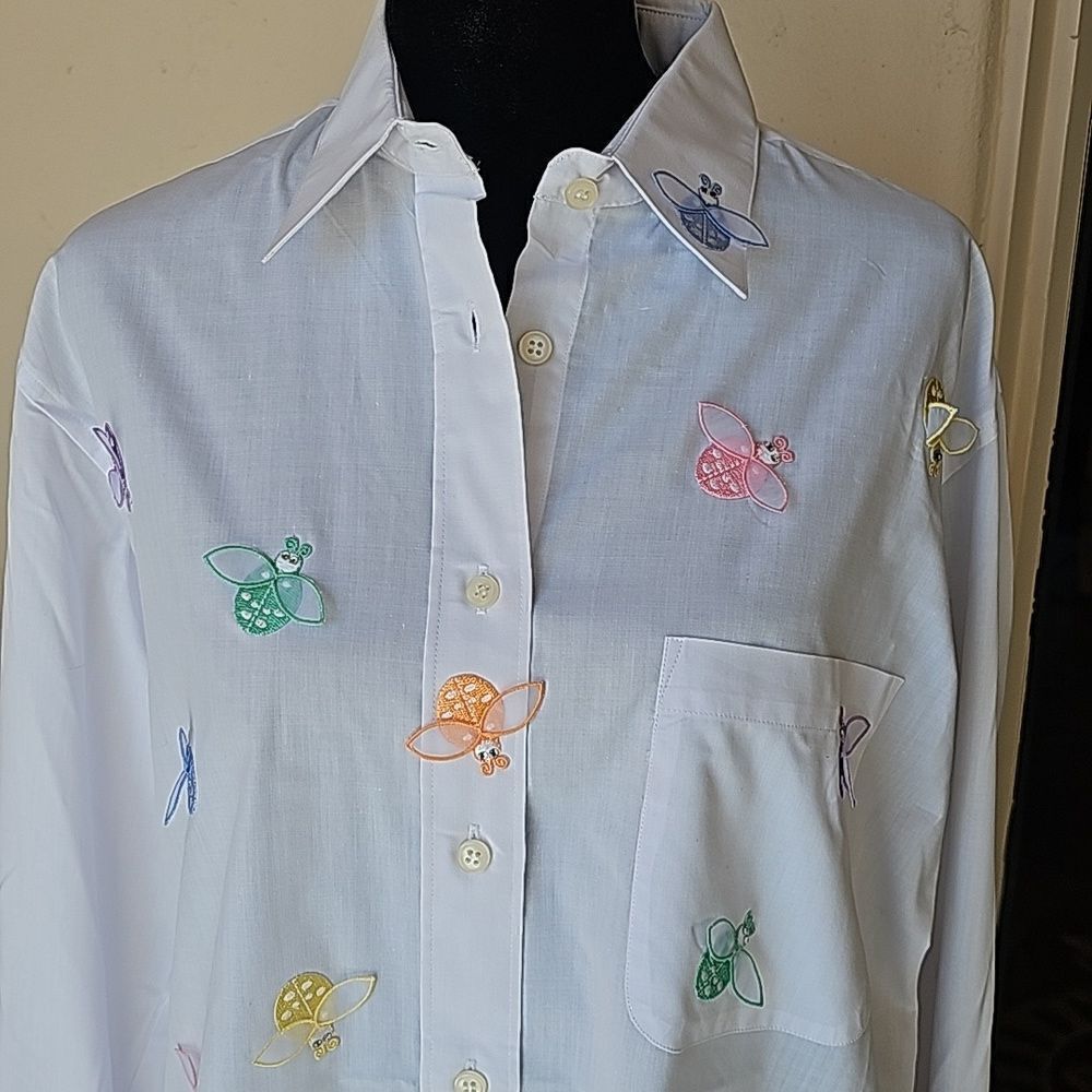 Pastel ladybugs everywhere on this white button front blouse size small